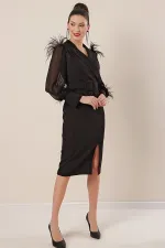 Wrap-neck, belted waist, front slit, chiffon sleeves with cuffs and feather detail, crepe dress.