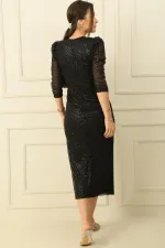 Robe en maille à manches longues et col en V avec nœud sur le devant