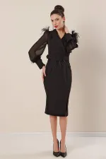 Wrap-neck, belted waist, front slit, chiffon sleeves with cuffs and feather detail, crepe dress.