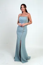 Robe longue en crêpe à doublure ornée de pierres et drapée sur le devant