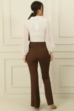 Pantalon taille haute à pattes d'éléphant en lycra avec poches