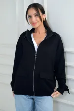 Gilet en tissu Osyho pour femme, avec fermeture éclair sur le devant, poche cargo et détail de boucle.