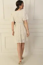 Wrap-neck, belted waist, lined, ruffled sleeves, slit, lace dress.