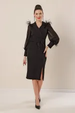 Wrap-neck, belted waist, front slit, chiffon sleeves with cuffs and feather detail, crepe dress.