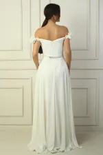 Robe longue en mousseline pour femme, ornée d'un décolleté floral découpé au laser, doublée et ceinturée à la taille.