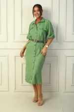 Long dress with button front, belted waist, and double pockets, linen-effect finish.