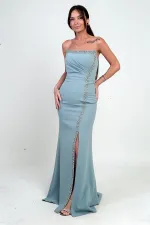 Robe longue en crêpe à doublure ornée de pierres et drapée sur le devant