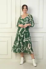 Robe portefeuille en mousseline à encolure Madonna, doublée, à nœuds croisés et motif abstrait