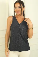 Blouse à col en V froncée sur le devant en lycra pailleté