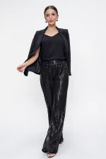 Pantalon en tulle doublé de sequins à taille élastique