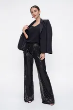 Pantalon en tulle doublé de sequins à taille élastique