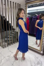 Robe en mousseline doublée et entièrement plissée