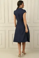 Button-front, belted, pocketed linen-effect dress.