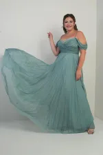 Robe longue BB à paillettes, sans bretelles, ornée de pierres et décolleté bustier.