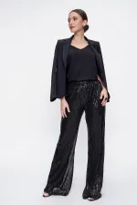 Pantalon en tulle doublé de sequins à taille élastique
