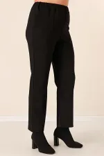 Pantalon grande taille avec taille élastique, poches latérales et tissu Lycra