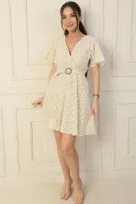 Wrap-neck, belted waist, lined, ruffled sleeves, slit, lace dress.