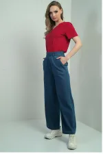 Jean à jambes larges pour femme avec taille élastique et poches latérales à scratch