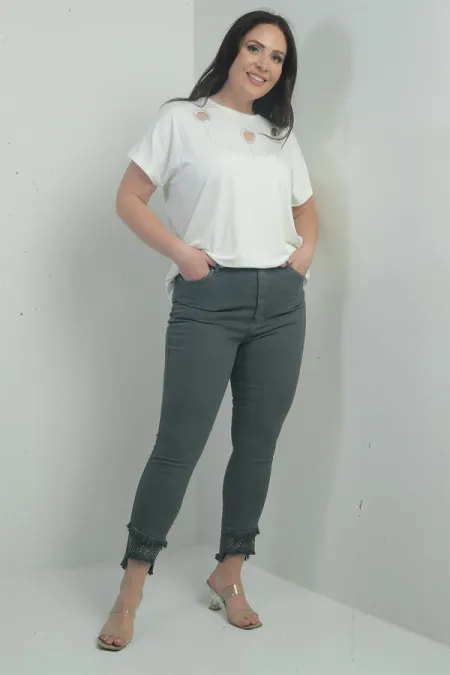 Pantalon skinny en toile lycra grande taille pour femme, avec détails en pierre et pompons
