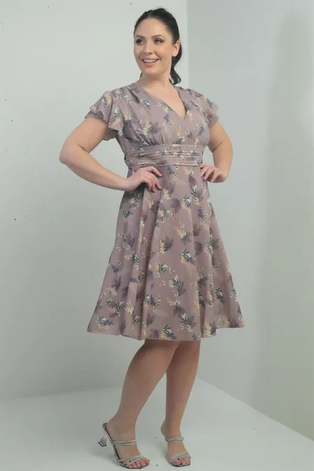Wrap-neck, ruffled sleeve, lined plus-size printed linen dress.