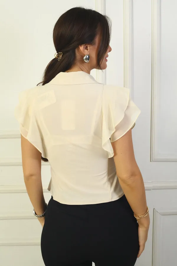 Chemisier sans manches en mousseline de soie à double boutonnage et épaules boutonnées