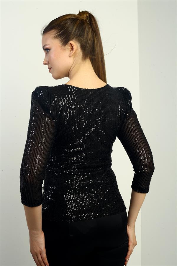 Chemisier à manches longues pour femme, à encolure cache-cœur, doublé et orné de sequins.