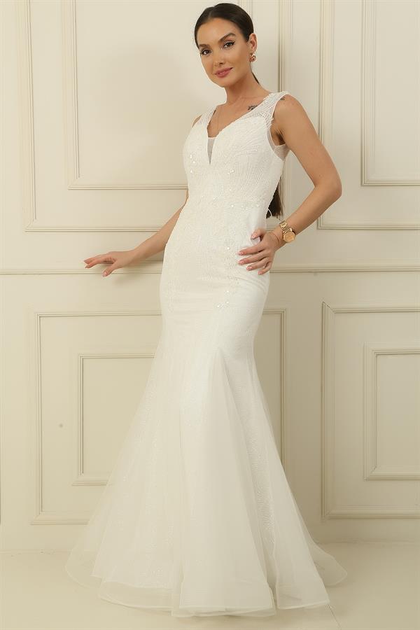 Robe sirène longue à paillettes, doublée, ornée de sequins et de perles, avec un dos nu et des sequins scintillants.