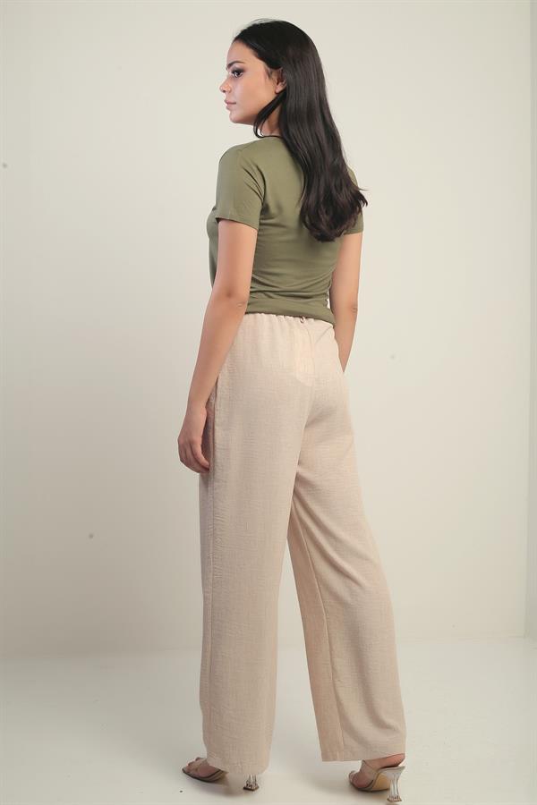 Pantalon palazzo pour femme avec taille élastiquée, poches et détails plissés