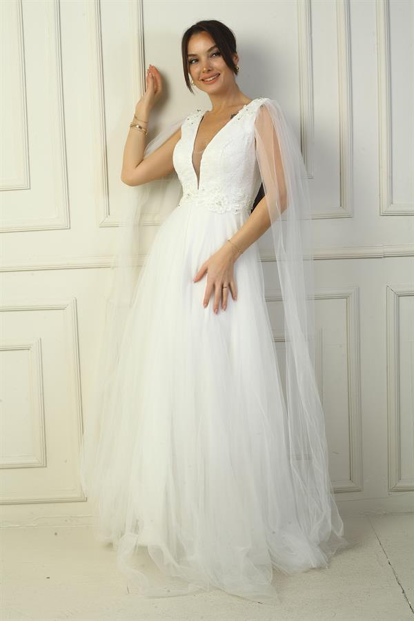 Robe de soirée longue en tulle pour femme, décolleté en V devant et dos, ornée de perles et à taille large.