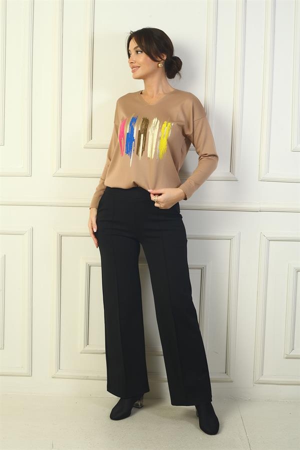 Pantalon en acier à jambes larges pour femme, avec taille élastique, poches latérales et finitions.