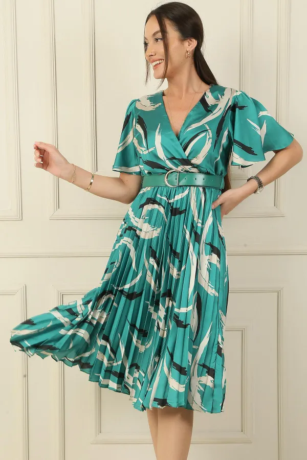 Wrap-neck, slit, ruffled sleeve, patterned, belted, pleated, lined satin dress.