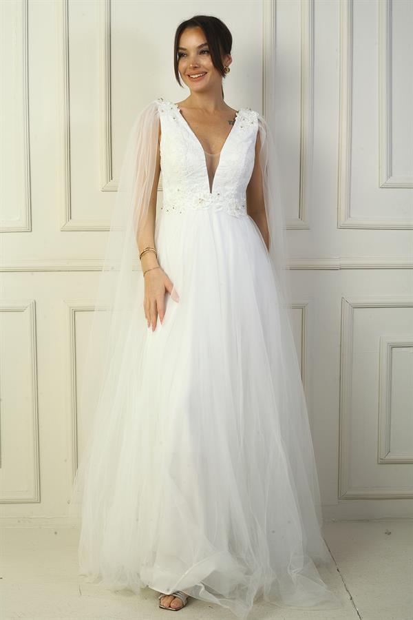 Robe de soirée longue en tulle pour femme, décolleté en V devant et dos, ornée de perles et à taille large.