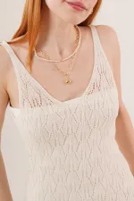 Robe ajourée à col en V et détails à pompons couleur crème en gros