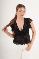 Blouse noire brodée en daim transparent à col V, disponible en gros