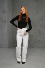 Pull noir tricoté à col roulé et détails côtelés, en gros