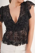 Blouse noire brodée en daim transparent à col V, disponible en gros