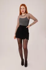 Mini-jupe noire en gros avec détail fendu