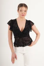 Blouse noire brodée en daim transparent à col V, disponible en gros