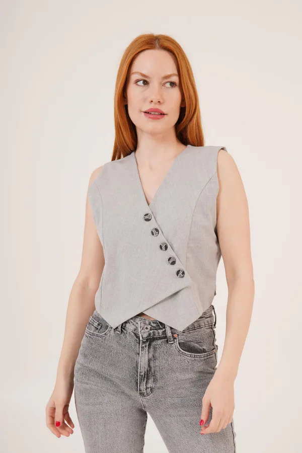 Gilet gris boutonné à col en V et coupe triangulaire en gros