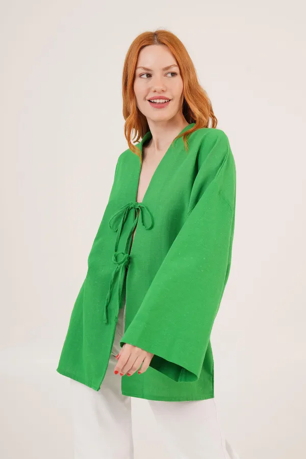 Tunique verte en gros avec détail de cravate sur le devant et manches espagnoles