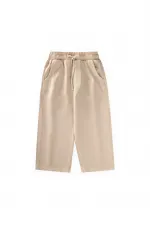 Loose-fitting girls' trousers, ages 2-12, beige. Loose-fitting girls' trousers, ages 2-12, beige.