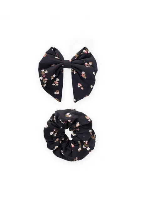 Hair clip with ribbon and elastic, navy blue floral design.