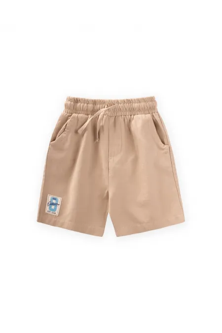 Capri en flanelle beige avec étiquette détaillée pour enfants de 1 à 7 ans