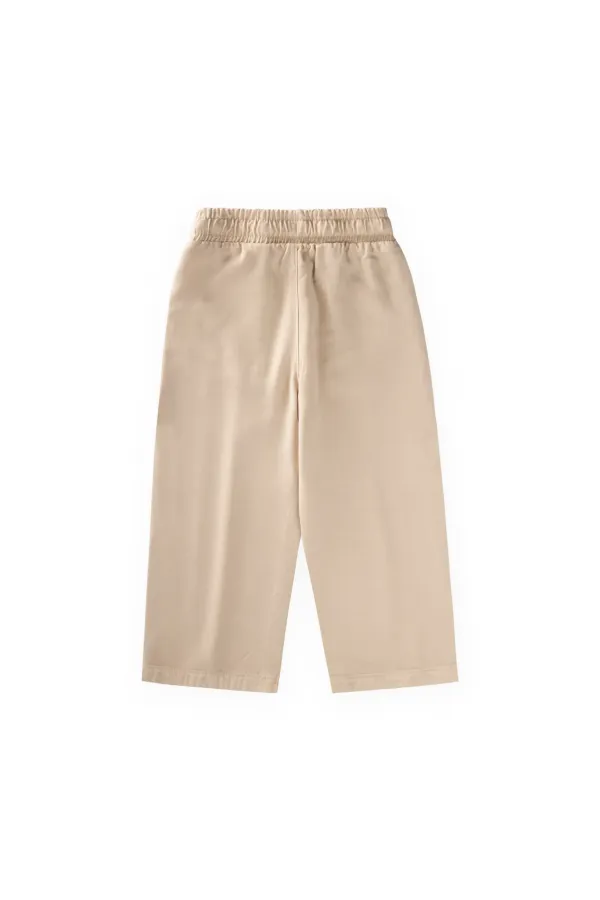 Loose-fitting girls' trousers, ages 2-12, beige. Loose-fitting girls' trousers, ages 2-12, beige.