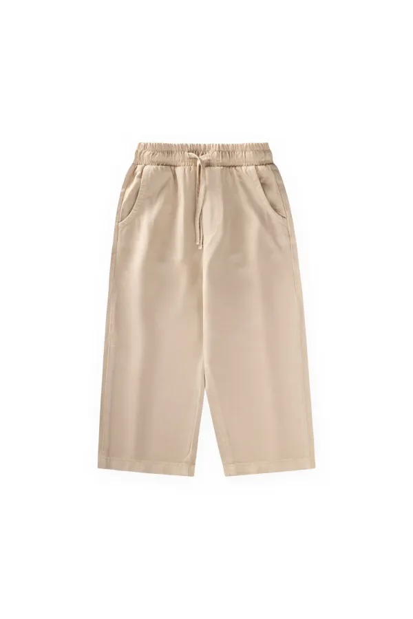 Loose-fitting girls' trousers, ages 2-12, beige. Loose-fitting girls' trousers, ages 2-12, beige.