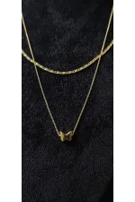 Collier double chaîne en or avec motif papillon