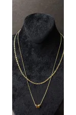 Collier double chaîne en or avec motif papillon