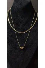 Collier double chaîne en or avec motif papillon