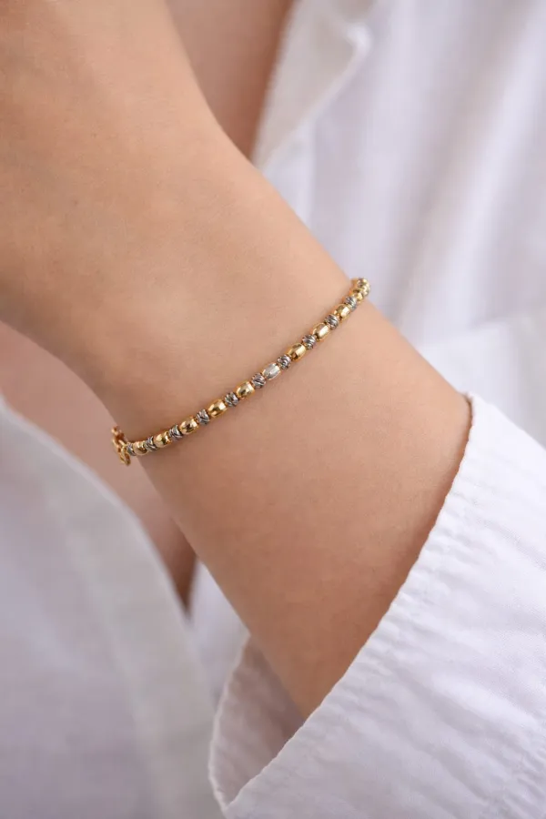 Bracelet élégant orné de perles bicolores