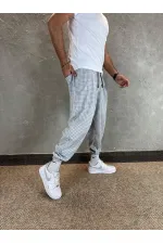 Erkek Ekru Gri etnik desenli Beli ve Paçası Lastikli Eşofman Altı HZL24S-MXC8989-160
